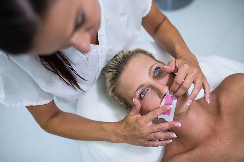 Women get facial waxing in Huntsville Nails and Spa