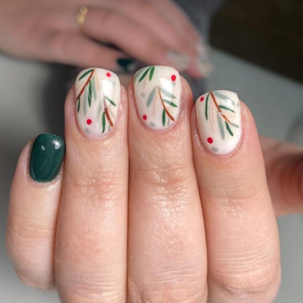 Nails in green with Christmas symbols