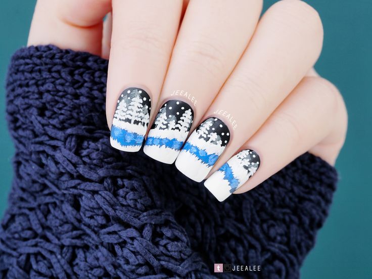 Nails in blues and Christmas symbols